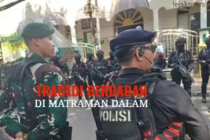 Garis polisi yang melintang di depan reruntuhan bangunan dan kendaraan yang hangus terbakar pascabentrokan massal di kawasan perbatasan Jakarta Pusat dan Jakarta Timur.